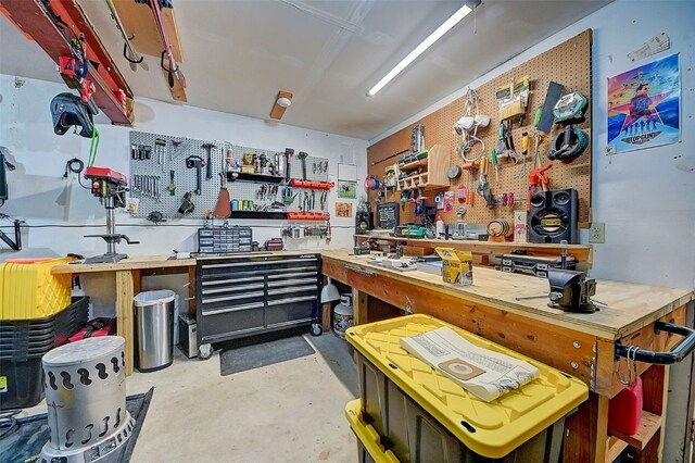 interior space with a workshop area and concrete floors