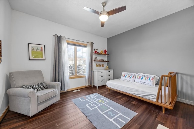 bedroom with wood finished floors, baseboards, and ceiling fan