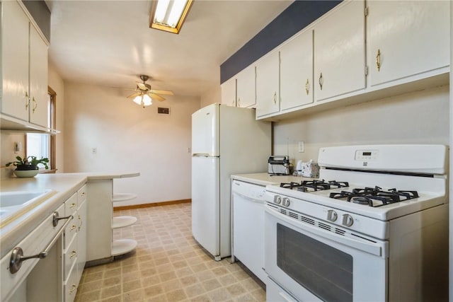 kitchen with white cabinetry, white appliances, light countertops, baseboards, and ceiling fan