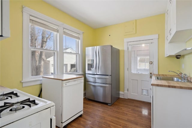 kitchen featuring a sink, white appliances, butcher block countertops, and dark wood-style floors