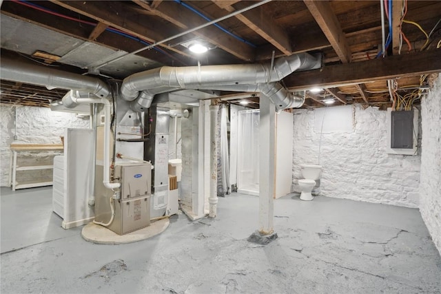 unfinished below grade area featuring electric panel and heating unit