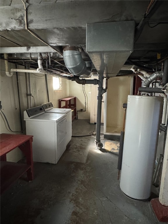 below grade area featuring washing machine and dryer and water heater