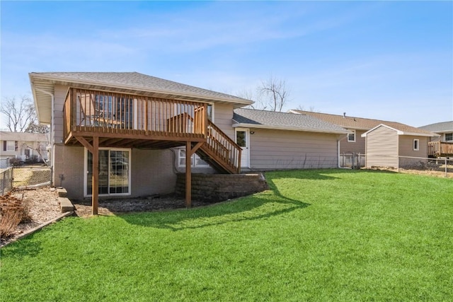 back of property featuring a yard, a deck, and fence