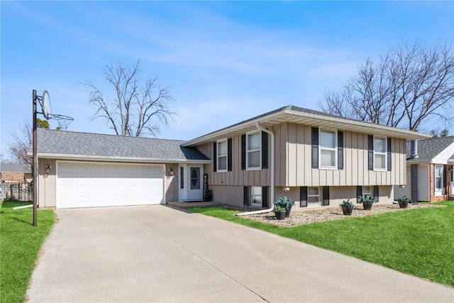 tri-level home featuring a front yard, driveway, brick siding, a garage, and board and batten siding