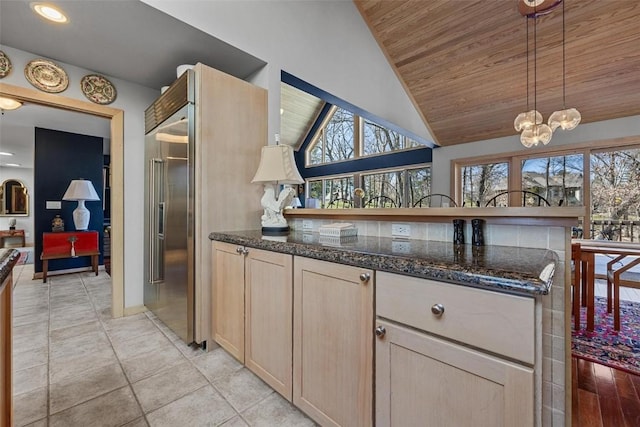 kitchen featuring light brown cabinets, pendant lighting, lofted ceiling, light tile patterned floors, and wooden ceiling