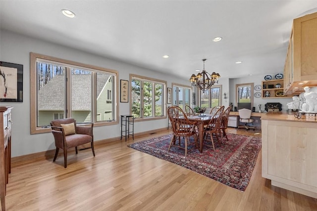 dining space featuring a chandelier, recessed lighting, light wood-style flooring, and baseboards