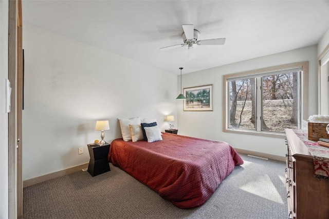 bedroom with carpet flooring, ceiling fan, and baseboards