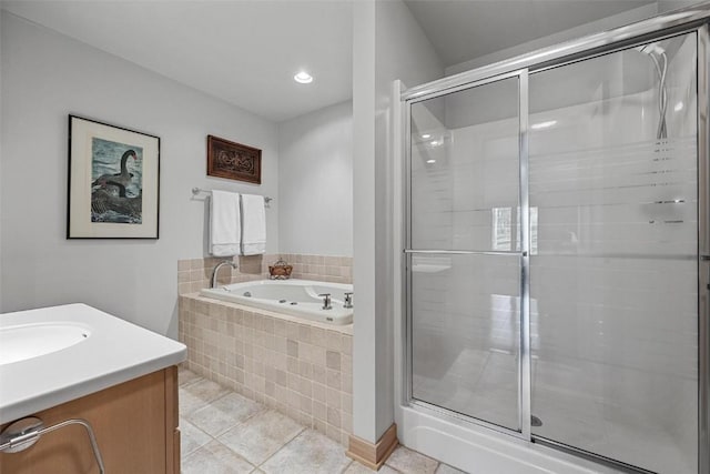 full bath featuring tile patterned flooring, a shower stall, a bath, and vanity