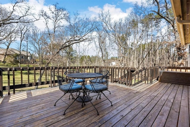 wooden terrace featuring outdoor dining area