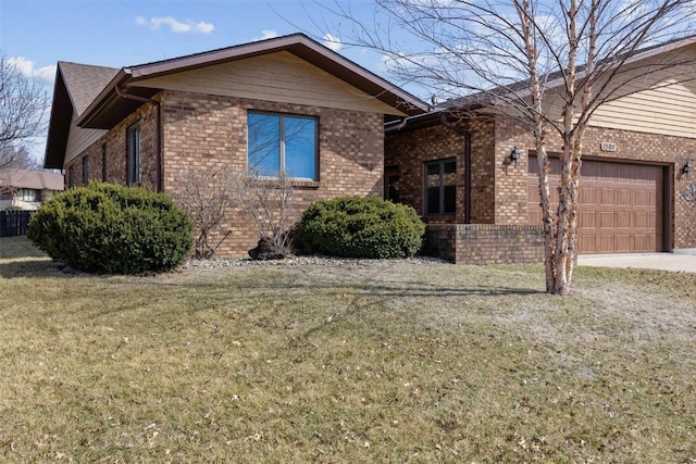 single story home with a front lawn, an attached garage, brick siding, and driveway