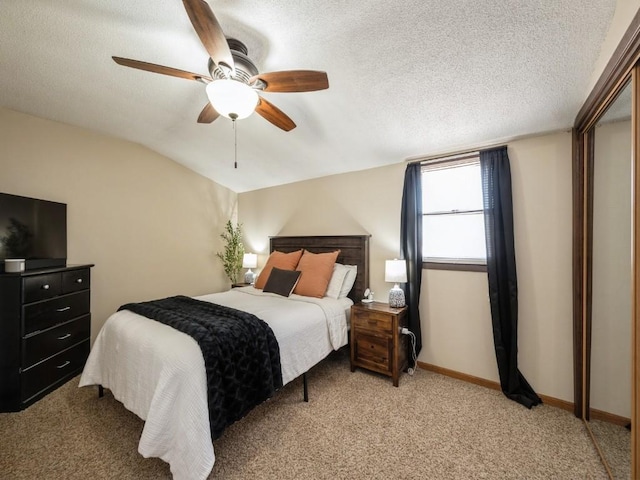 bedroom with baseboards, light carpet, a textured ceiling, and ceiling fan