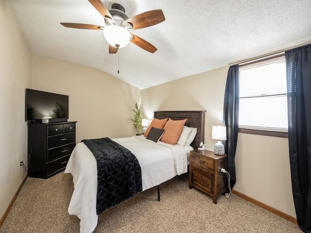 bedroom with baseboards, lofted ceiling, and light colored carpet