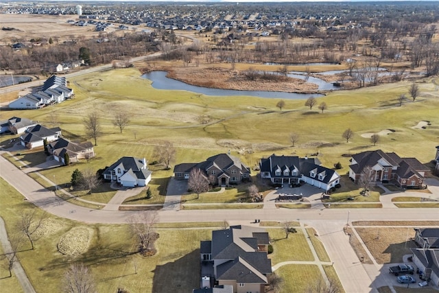 drone / aerial view with a residential view and a water view