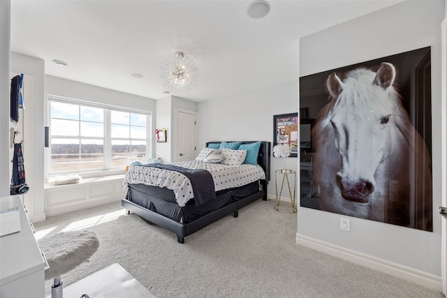 carpeted bedroom featuring baseboards