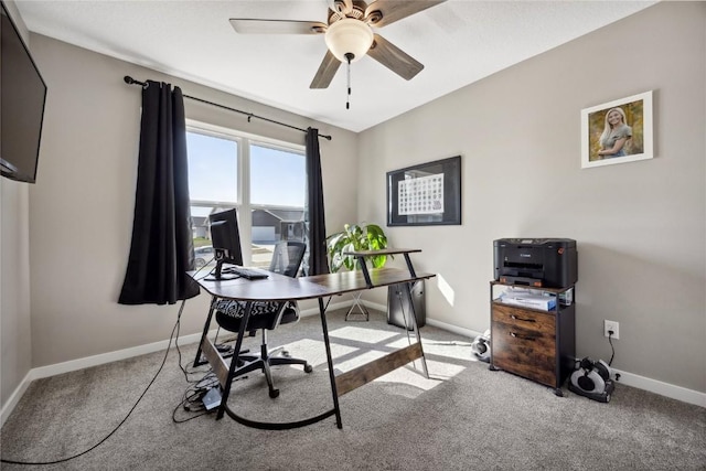 office featuring baseboards, a ceiling fan, and carpet flooring