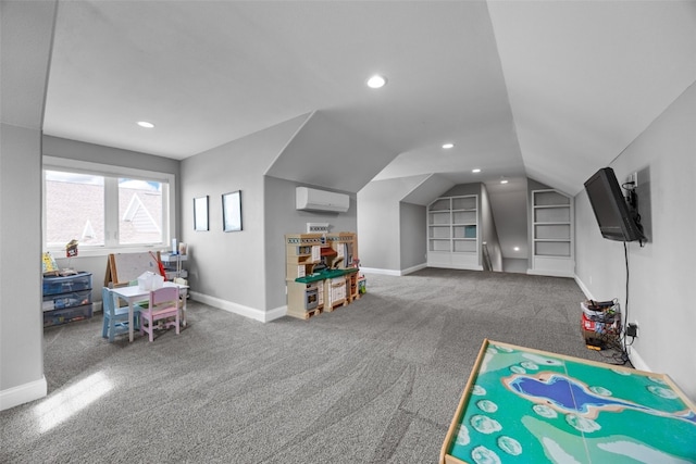 recreation room with baseboards, carpet floors, lofted ceiling, and an AC wall unit