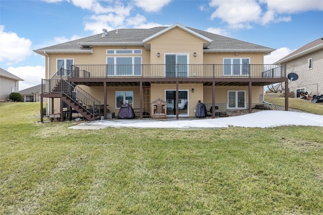 rear view of property with stairway, a patio, a yard, and a deck