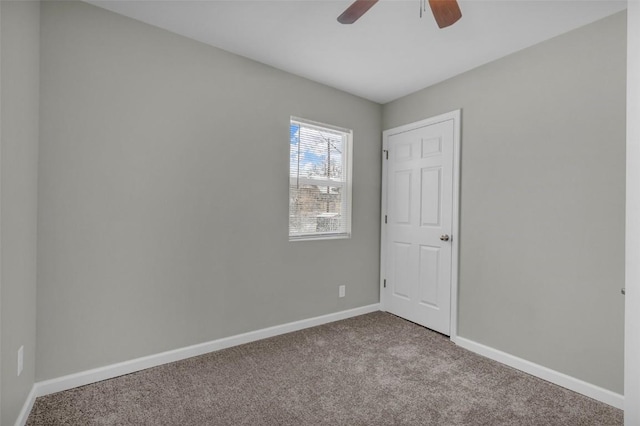 unfurnished bedroom with ceiling fan, baseboards, and carpet floors