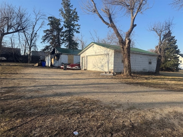 detached garage featuring driveway