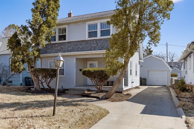 dutch colonial with covered porch, a shingled roof, an outdoor structure, concrete driveway, and a garage