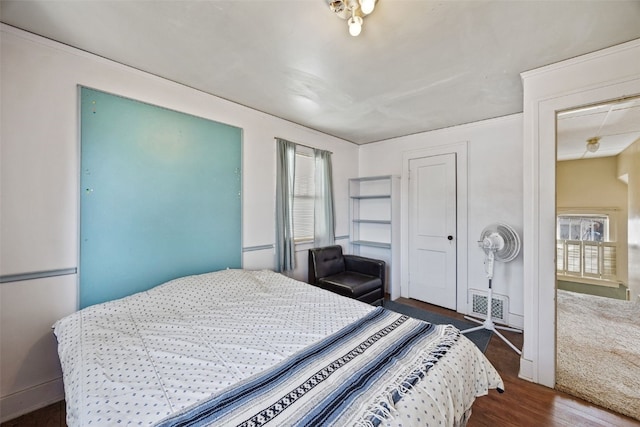 bedroom featuring wood finished floors