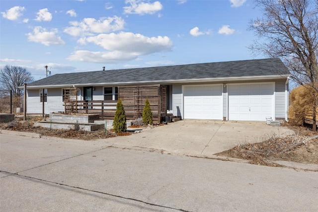 ranch-style home featuring a garage, roof with shingles, a porch, and driveway