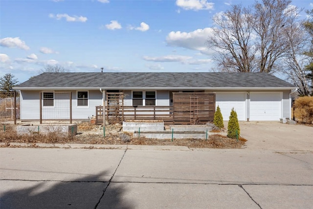 single story home with a porch, an attached garage, and driveway