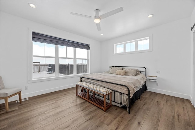 bedroom with recessed lighting, baseboards, a ceiling fan, and hardwood / wood-style flooring