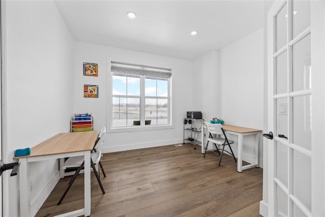 office area with recessed lighting, baseboards, and wood finished floors