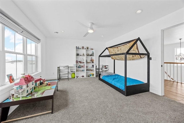 carpeted bedroom featuring recessed lighting, a ceiling fan, and baseboards