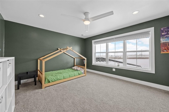 unfurnished bedroom featuring recessed lighting, baseboards, carpet floors, and a ceiling fan