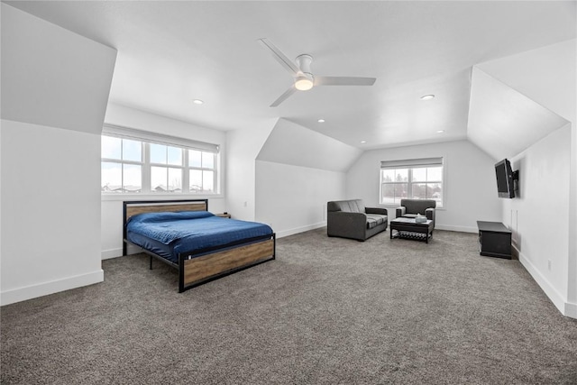 carpeted bedroom with lofted ceiling, baseboards, and ceiling fan