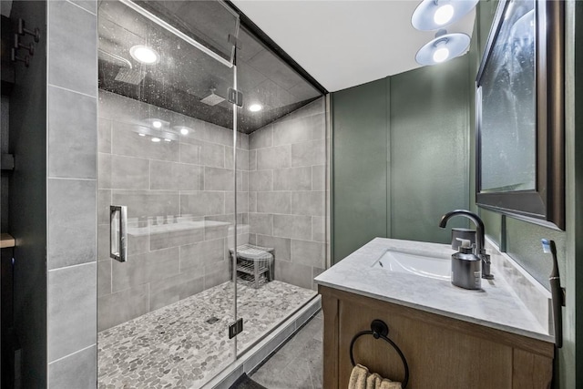 full bathroom with vanity and a shower stall