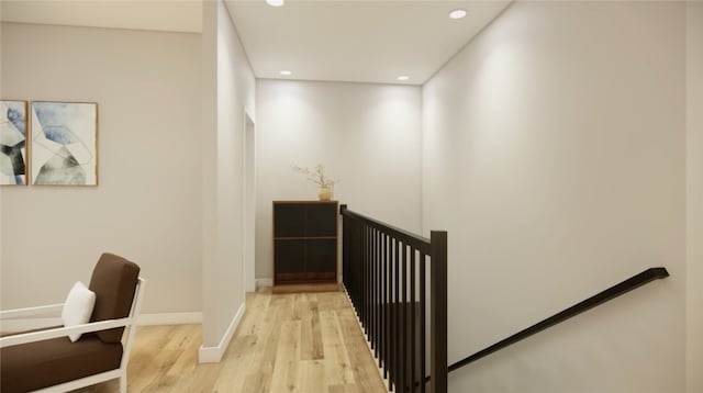 stairs with recessed lighting, baseboards, and wood finished floors