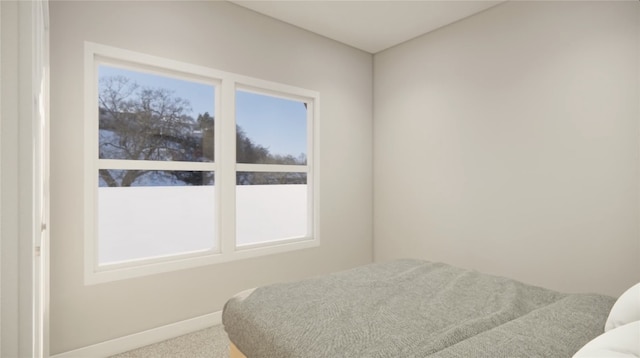 bedroom featuring carpet flooring and baseboards