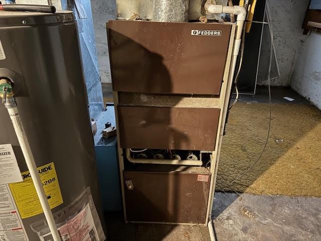 utilities featuring gas water heater and heating unit