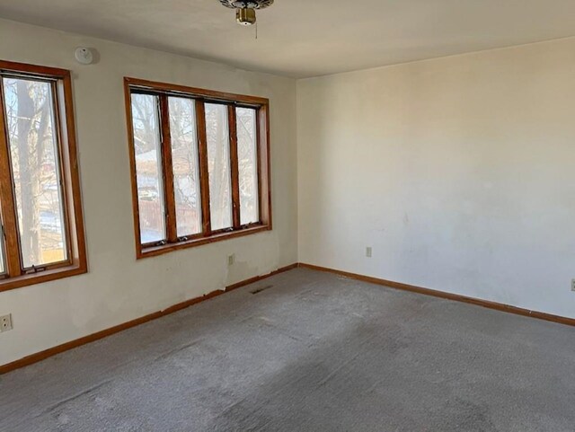 609 Baltimore St, Waterloo, IA 50702 - spare room featuring visible vents, carpet, and baseboards