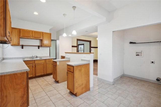 kitchen with open shelves, a kitchen island, decorative light fixtures, light countertops, and a sink