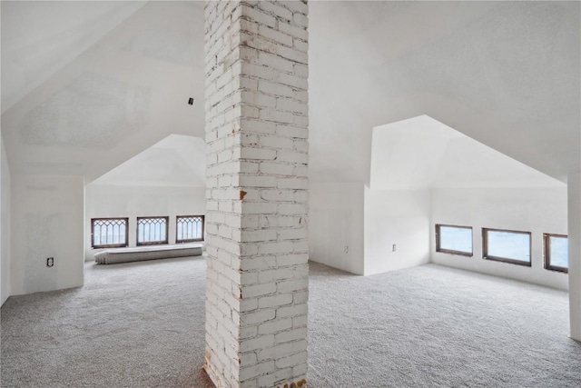 bonus room featuring a high ceiling and carpet