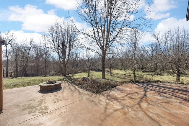 view of patio / terrace featuring an outdoor fire pit