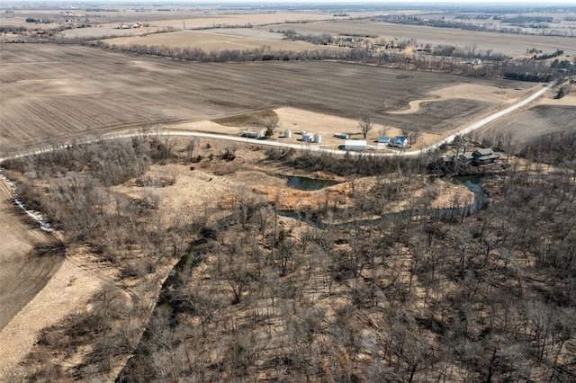 birds eye view of property featuring a rural view