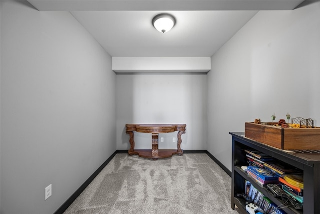 interior space featuring carpet flooring and baseboards