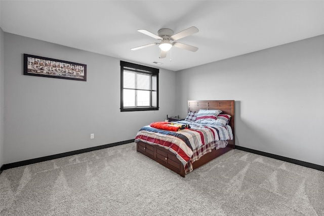 carpeted bedroom featuring a ceiling fan and baseboards