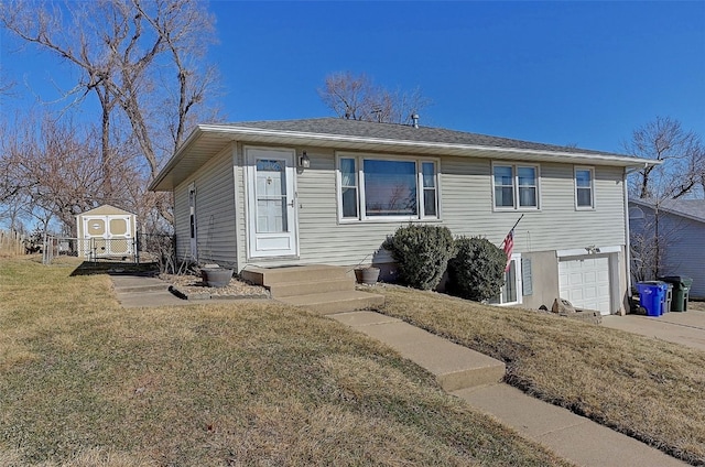 view of front of property featuring a front lawn, concrete driveway, and a garage