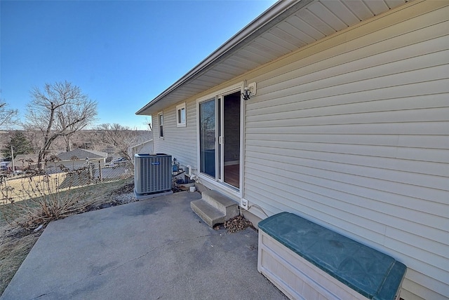 view of patio featuring entry steps, cooling unit, and fence