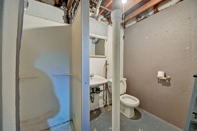 bathroom featuring toilet and concrete floors