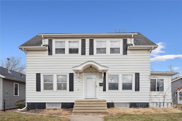 view of front of house featuring entry steps and roof with shingles