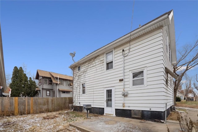 back of property featuring fence