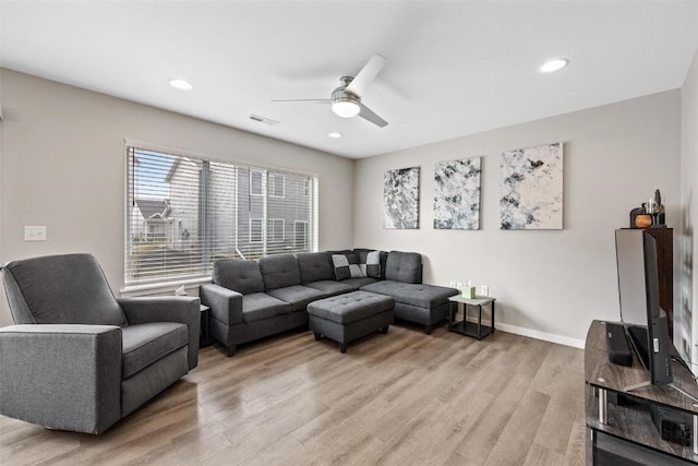 living room with visible vents, baseboards, recessed lighting, ceiling fan, and light wood-style floors