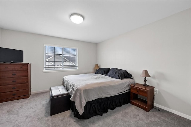 carpeted bedroom with baseboards